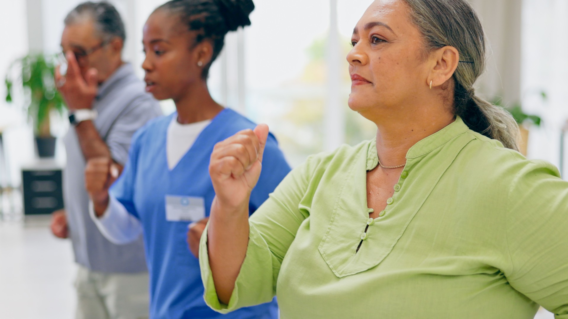 Nurse, old couple and health with physical therapy, exercise and recovery with wellness, treatment and fitness. Rehabilitation, healing and physiotherapist with pensioner, elderly man or mature woman